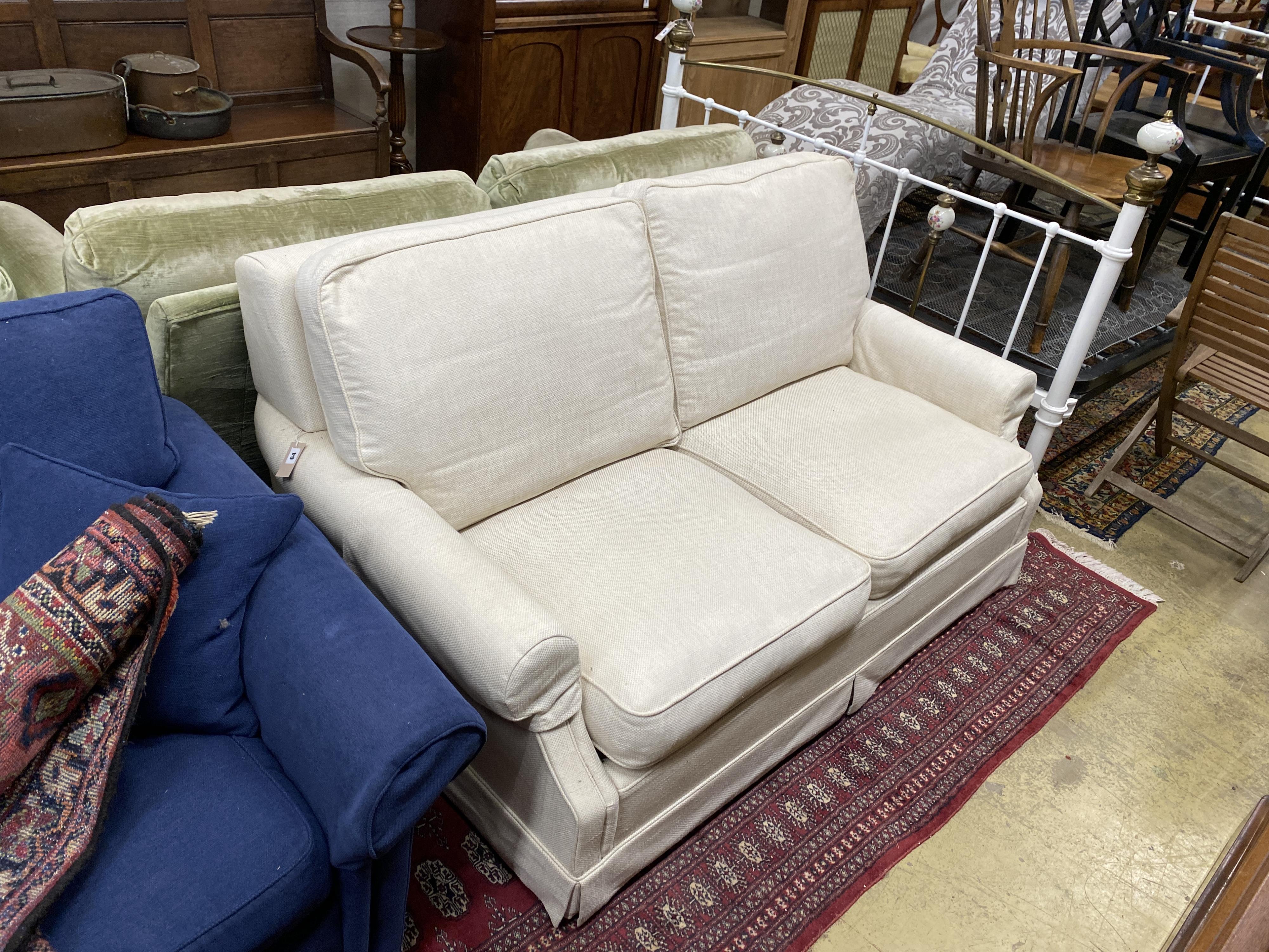 A Wesley Barrell cream fabric metal action two seater sofa bed, width 160cm, depth 96cm, height 82cm